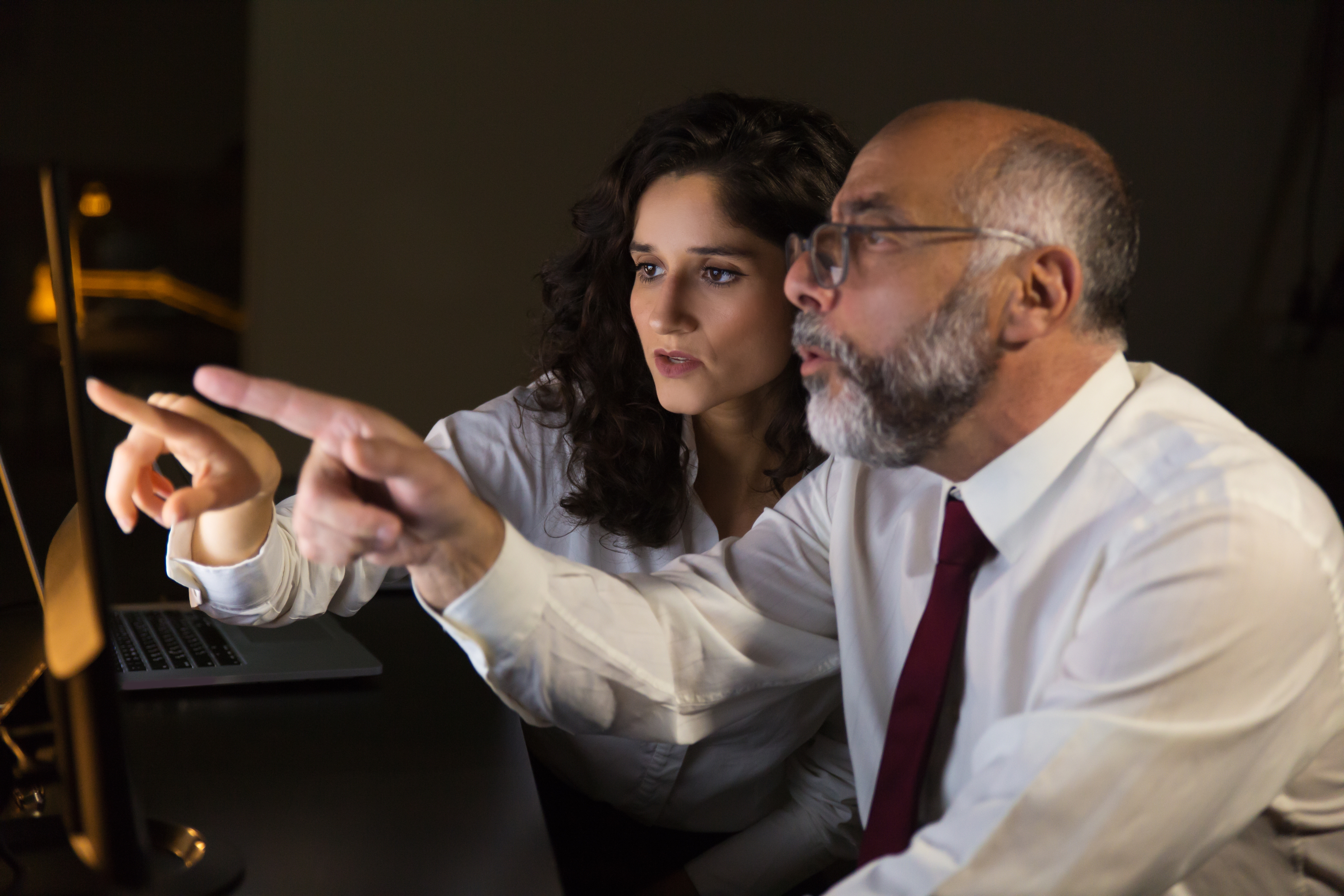 Shocked Coworkers Pointing Computer Monitor