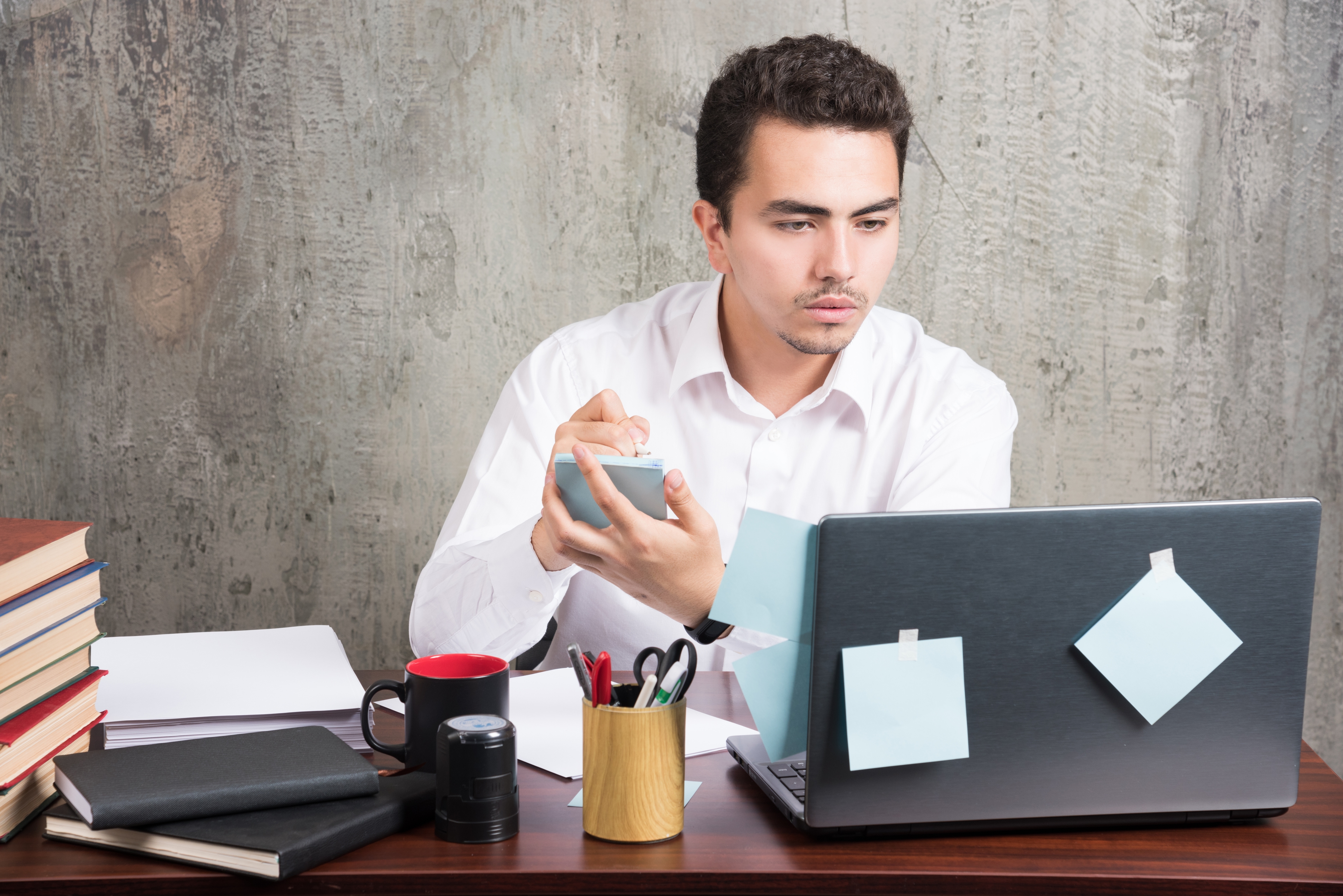 Office Employee Looking Laptop Holding Telephone Office Desk (2)