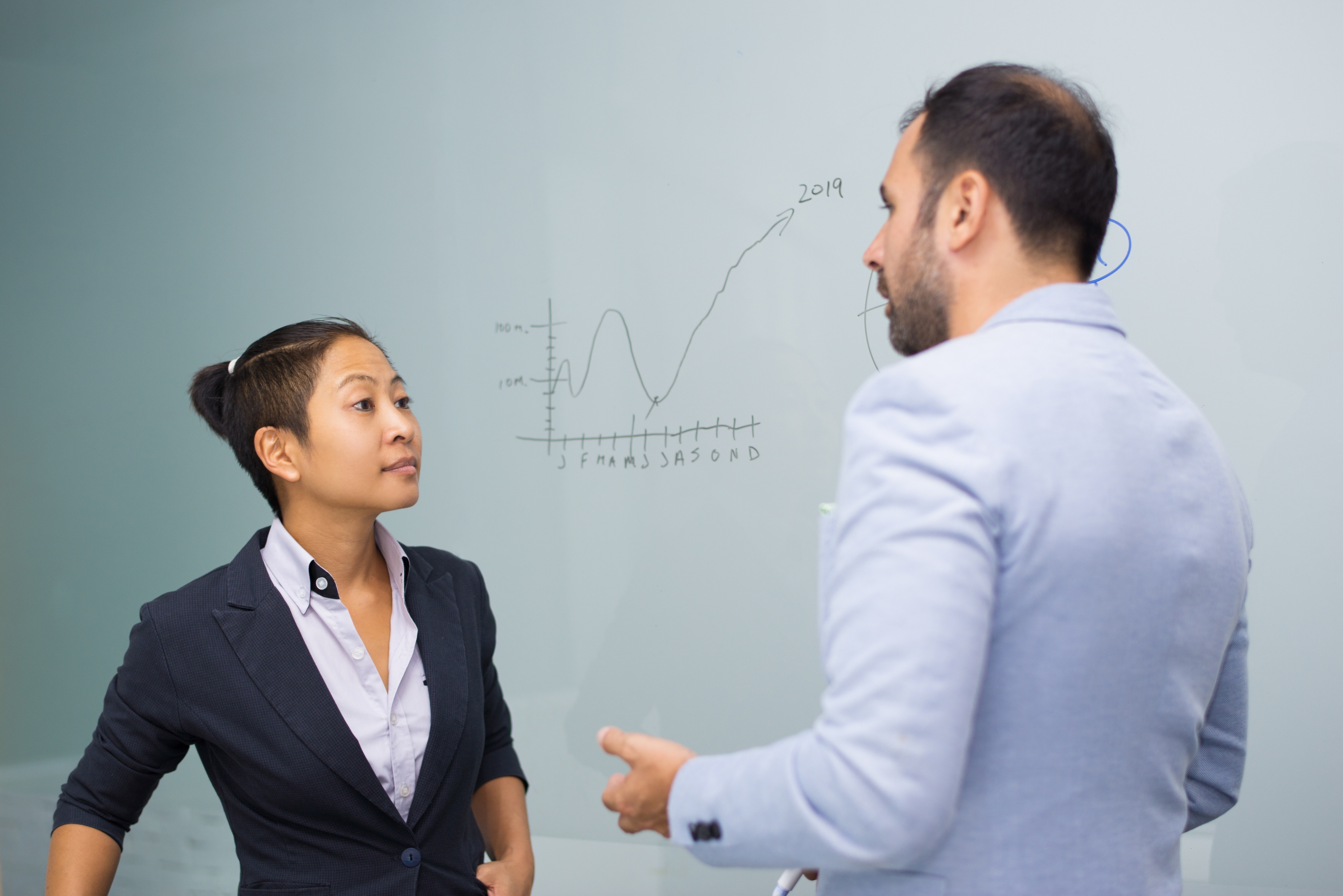 Serious Business Colleagues Standing Board Talking