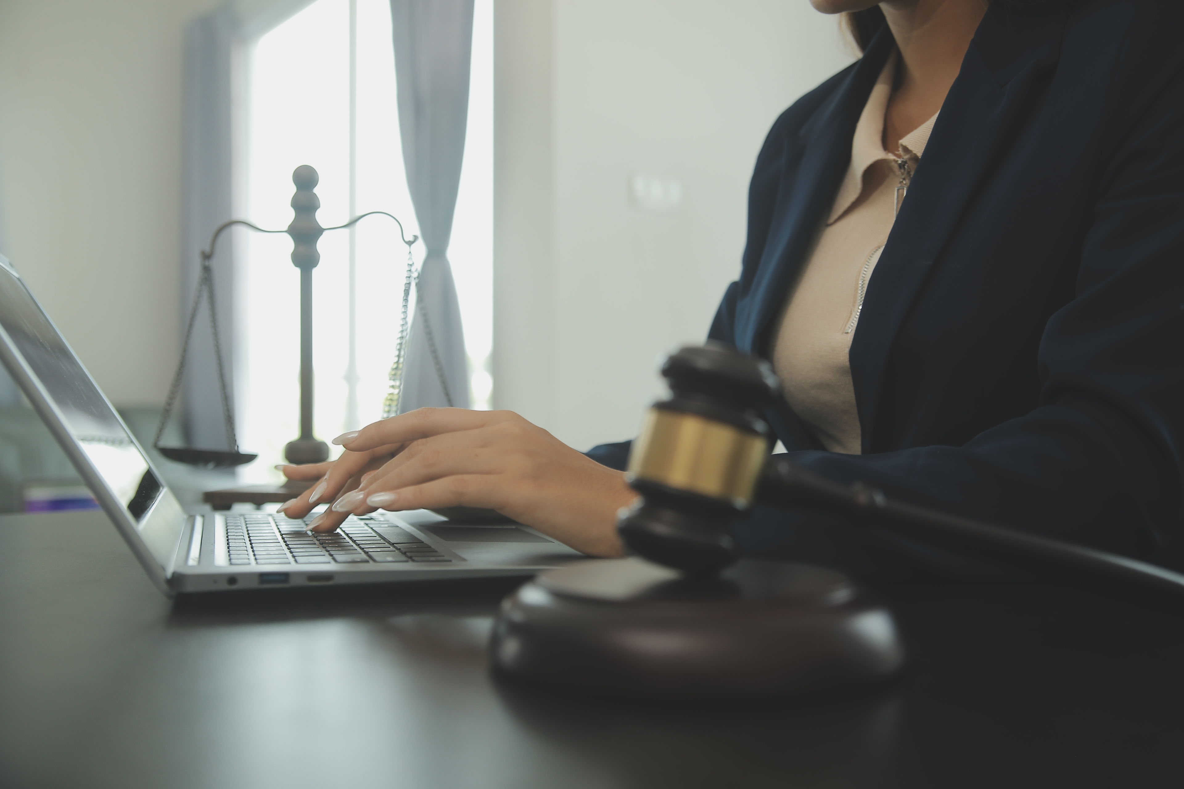 Justice Law Conceptmale Judge Courtroom With Gavel Working With Computer Docking Keyboard Eyeglasses Table Morning Light (1)