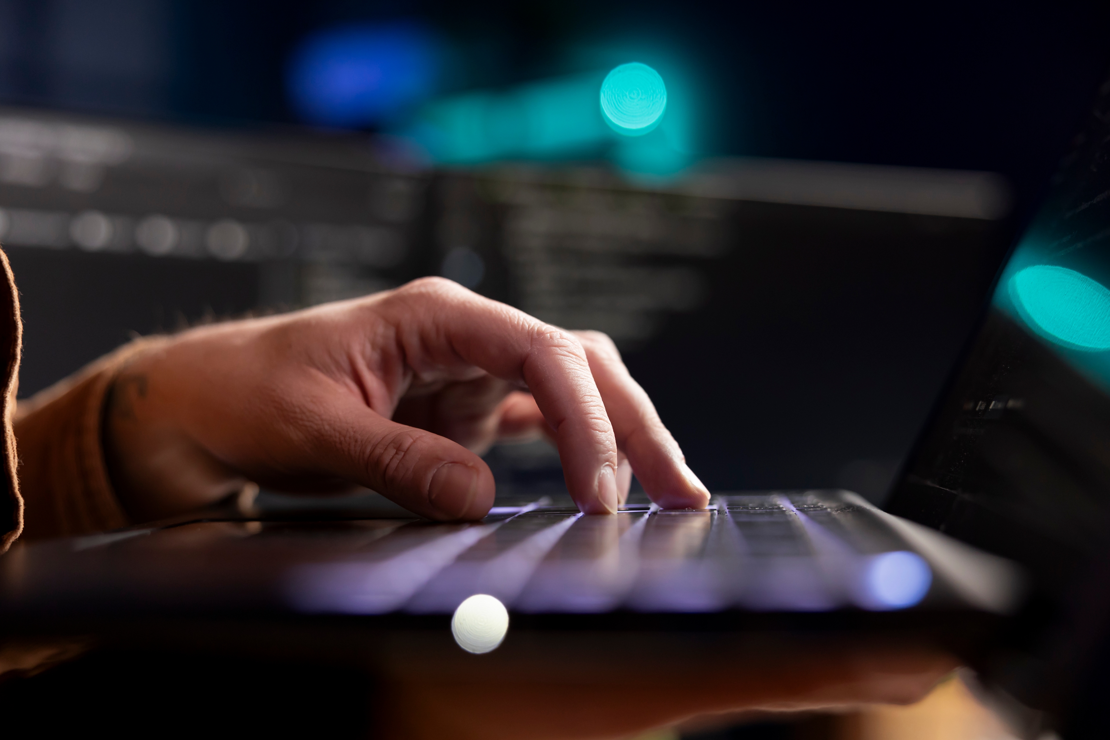 Cybersecurity Expert Using Laptop Look Company Security Vulnerabilities (1)