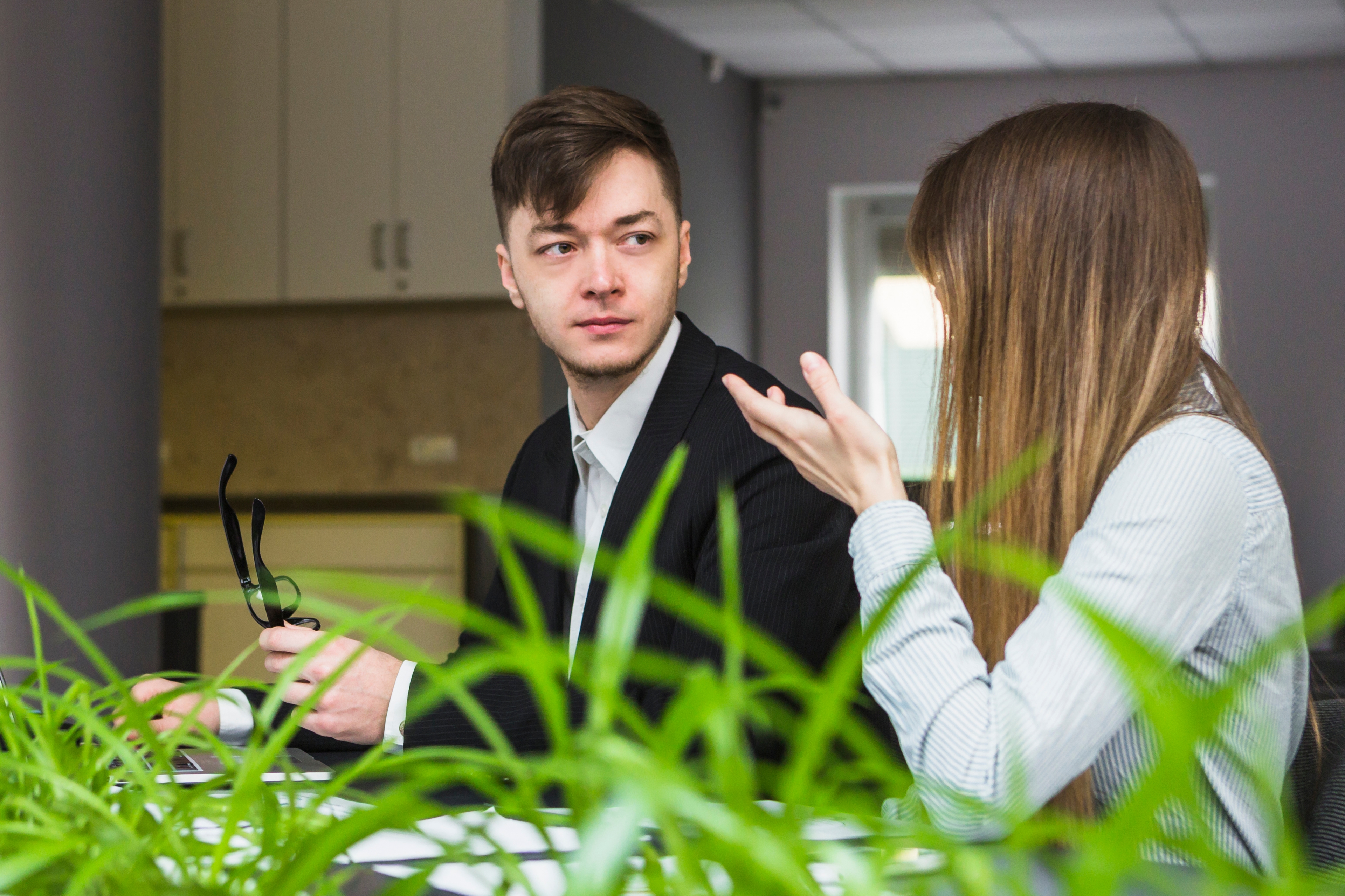 Two Businesspeople Having Conversation Office