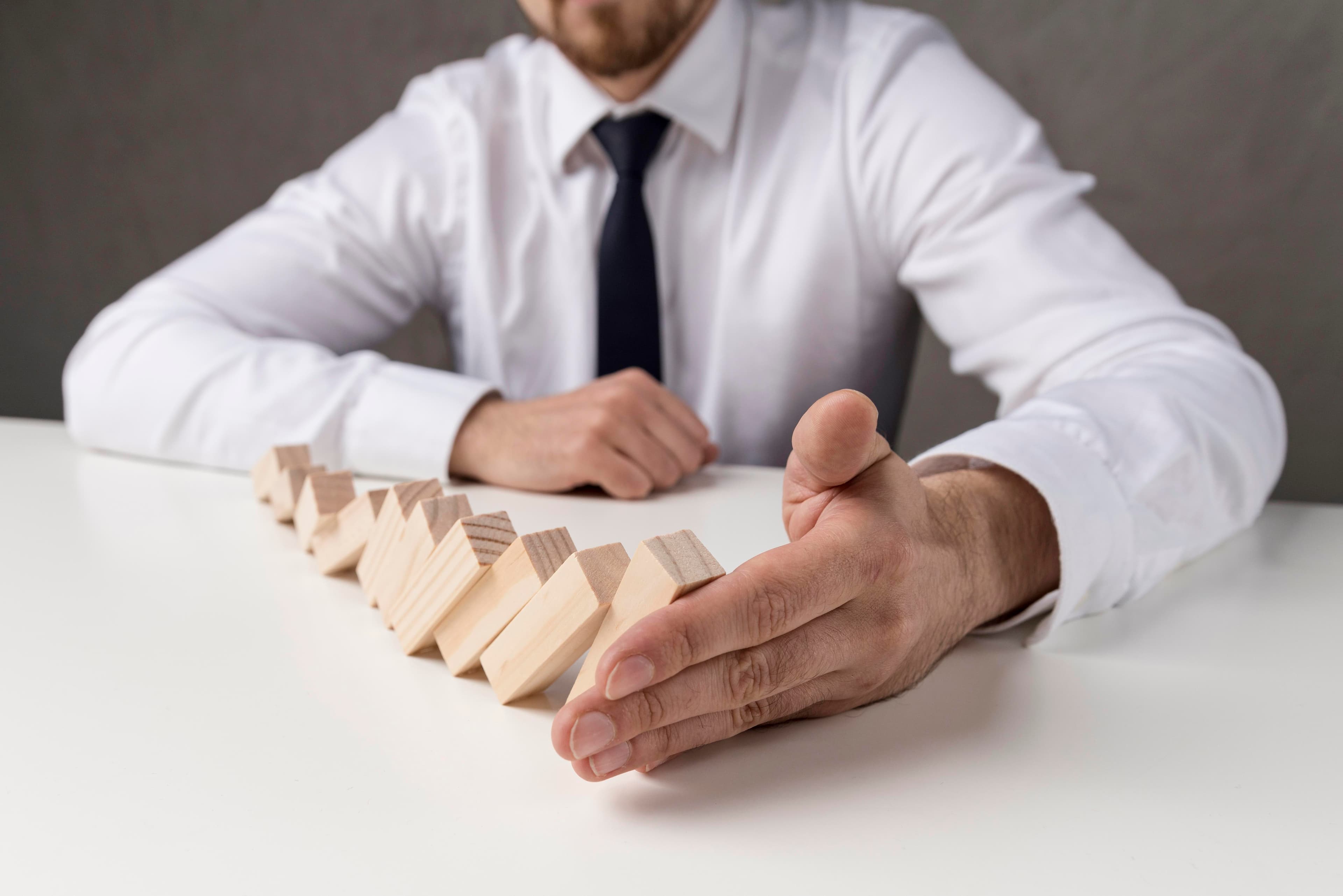 Businessman Suit Tie Holding Domino Pieces