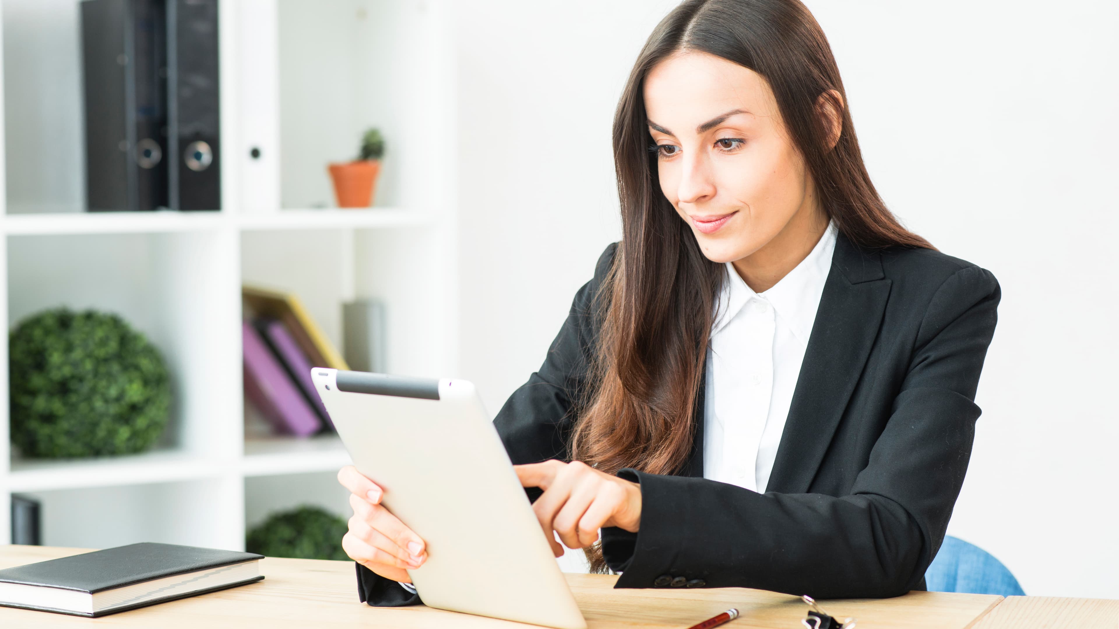 Smiling Young Businesswoman Touching Digital Tablet Sitting Office Desk
